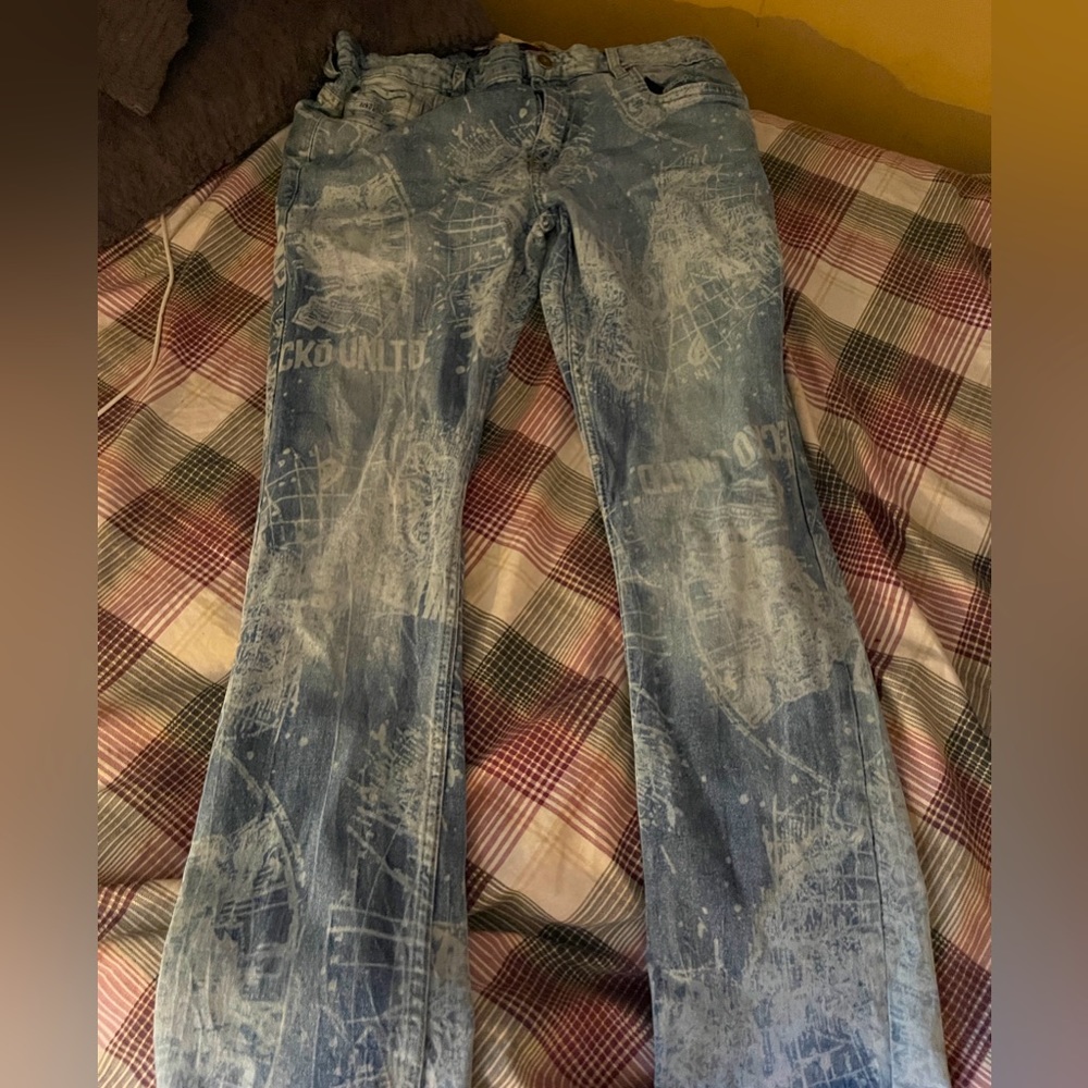 Skinny baggy jeans splatters newspaper print size 34